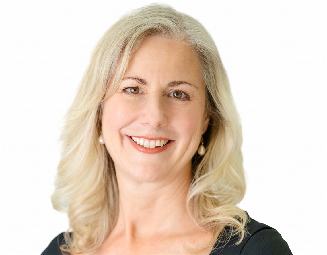 A smiling headshot of Jani Baker, Director Community.