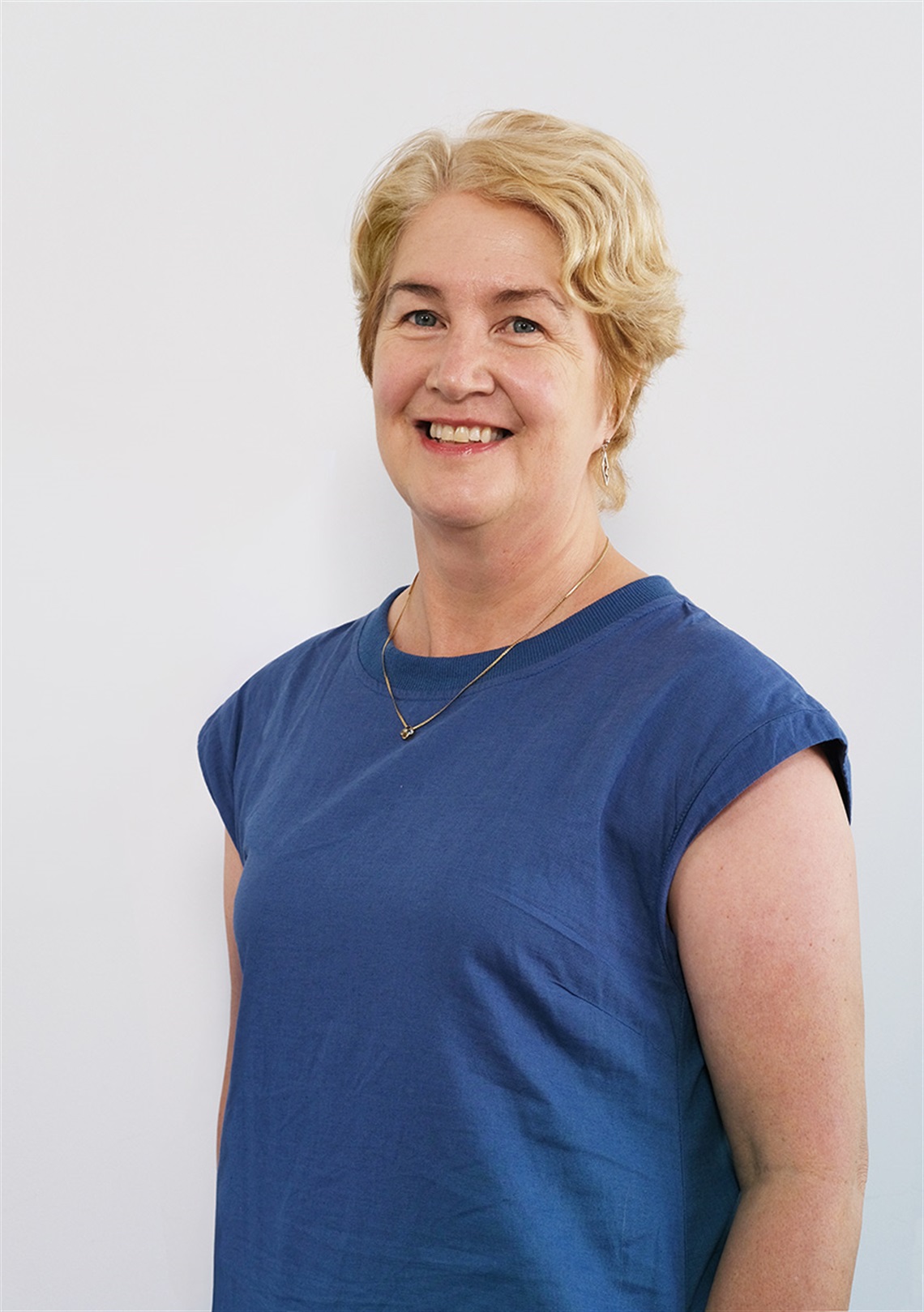 A photo of Sharon Mason smiling at the camera.